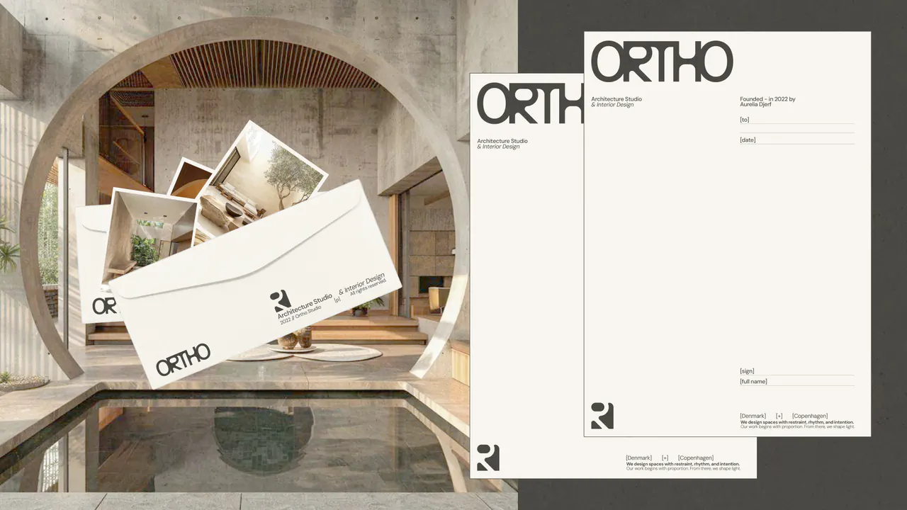 Ortho envelopes and letterhead paired with a concrete interior and circular architectural forms