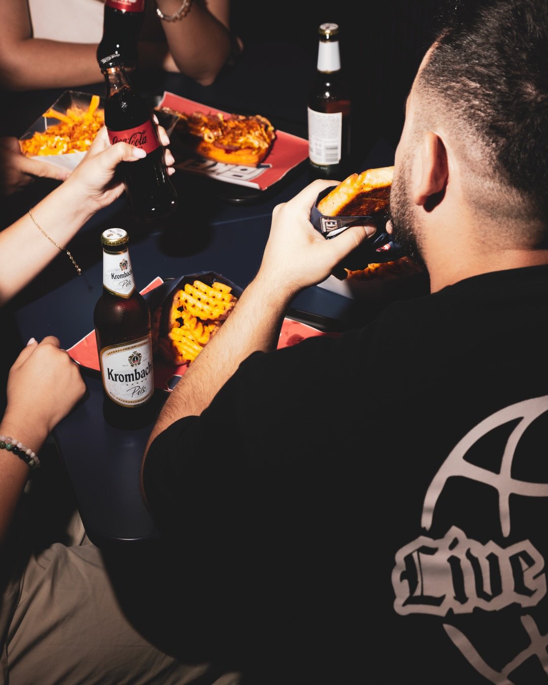 Friends sharing POKET food around a table.