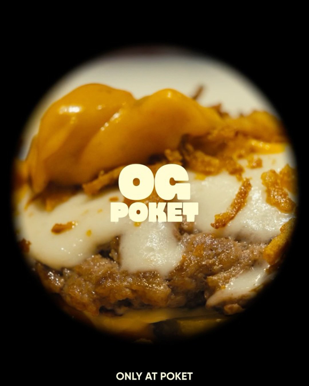 OG POKET close-up with melted cheese against black.