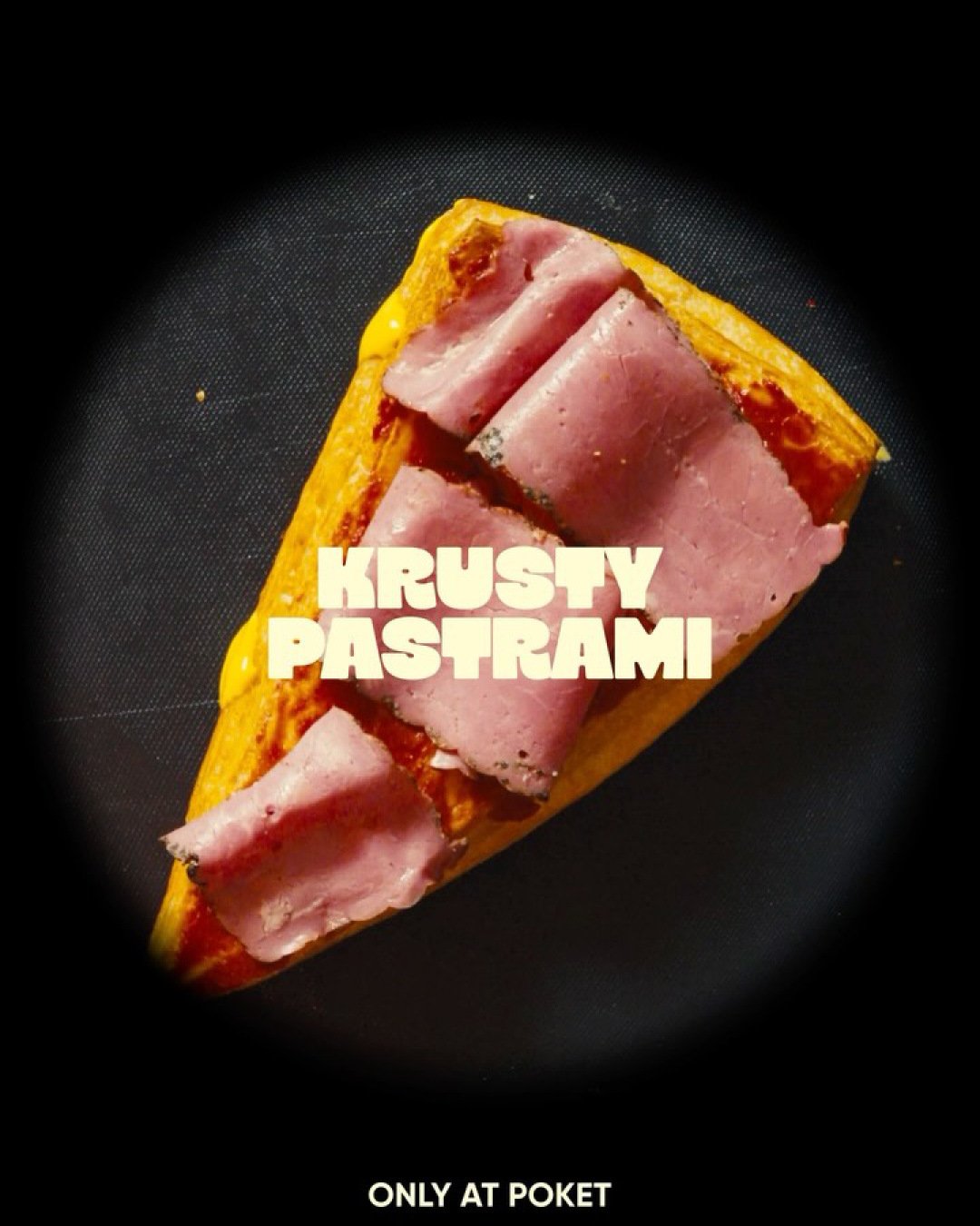 Krusty Pastrami close-up photographed against black.
