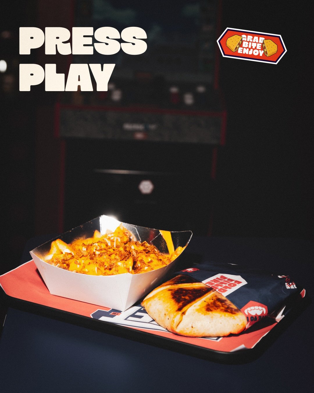 Press Play campaign featuring a POKET wrap and loaded fries on a tray.